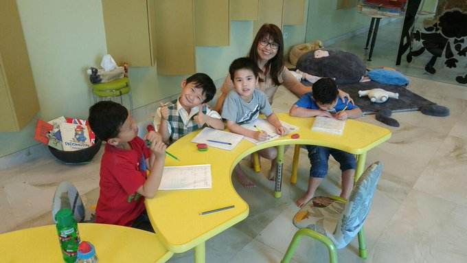 Children engaged in a phonics lesson, exploring the relationship between sounds and letters to boost reading skills.